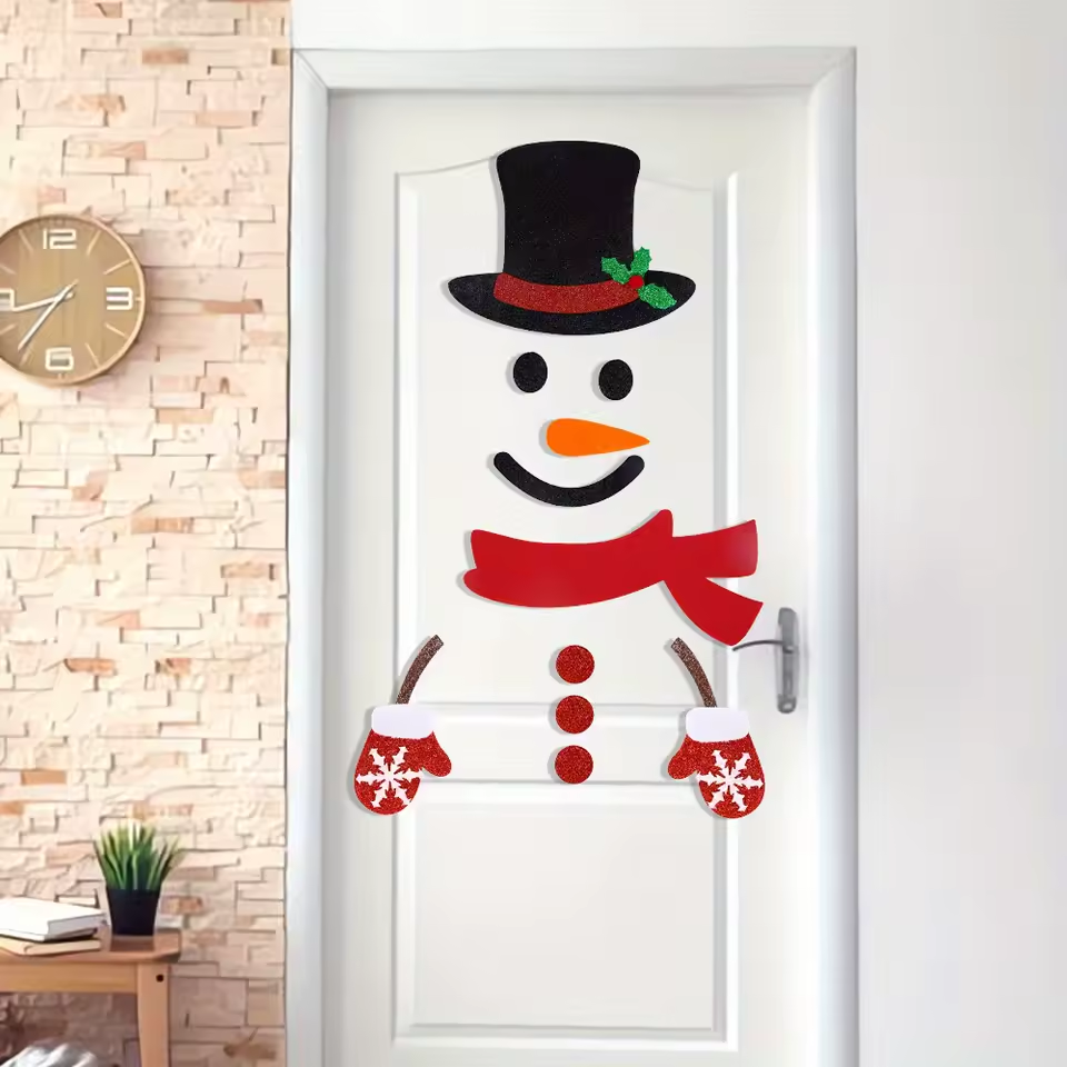 Supplier photograph of Color A felt snowman decorations on a white door; white background and furnishings not included.